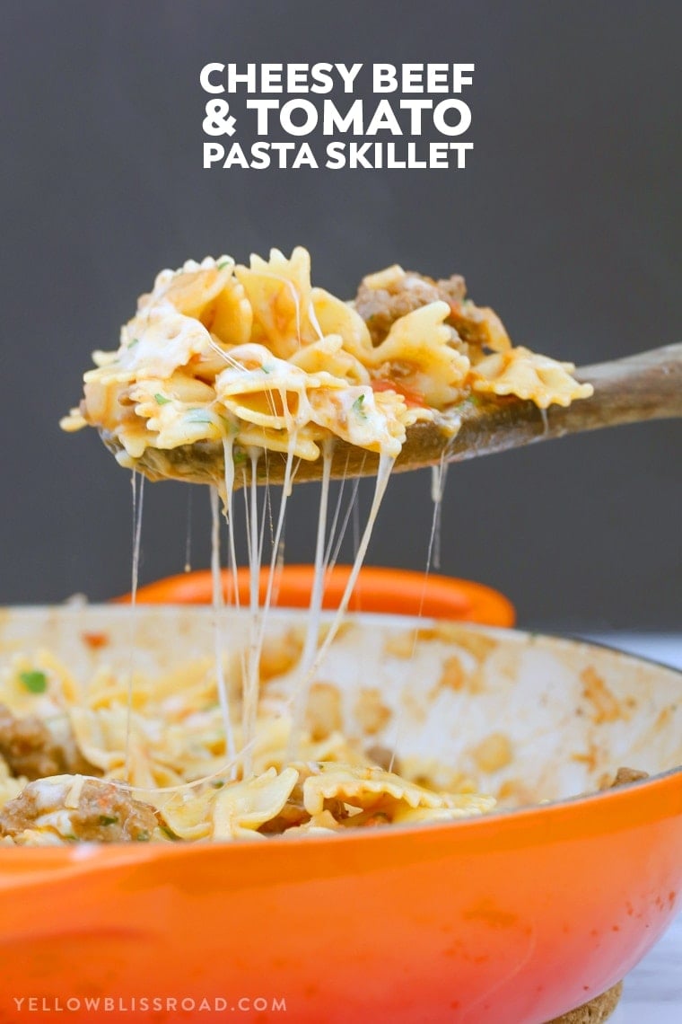 This Cheesy Beef & Tomato Pasta Skillet is sure to become your new favorite meal. All cooked in one pan, this easy weeknight dinner comes together in less than 30 minutes!