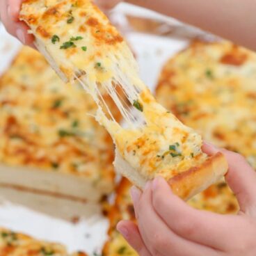 Sliced pieces of cheesy garlic bread