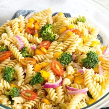 This Easy Vegetable Pasta Salad is one of my go-to summer recipes. It comes together in a snap and can be made ahead of time for a great menu addition!