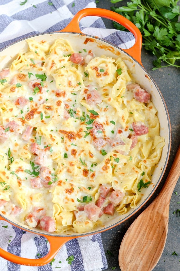 This One Pan Ham & Cheese Tortellini is super creamy and flavorful, and a delicious was to celebrate National Cheese Day! Everything is cooked together in one pan for a quick, family-friendly weeknight meal with easy clean up. One Pan Ham & Cheese Tortellini from above