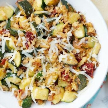 Zucchini with Sun Dried Tomatoes, Bacon, and Crispy Onions