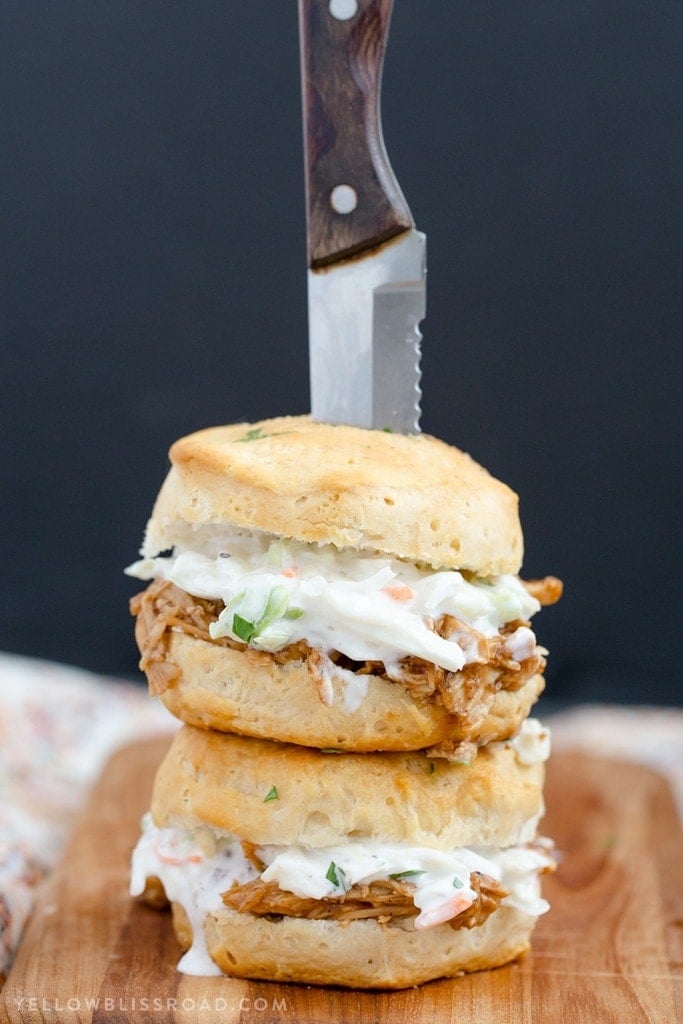 Barbecue Chicken Biscuit Sandwiches - Tender, flaky biscuits brushed with garlic butter and filled with tender BBQ chicken and a creamy, tangy coleslaw. 