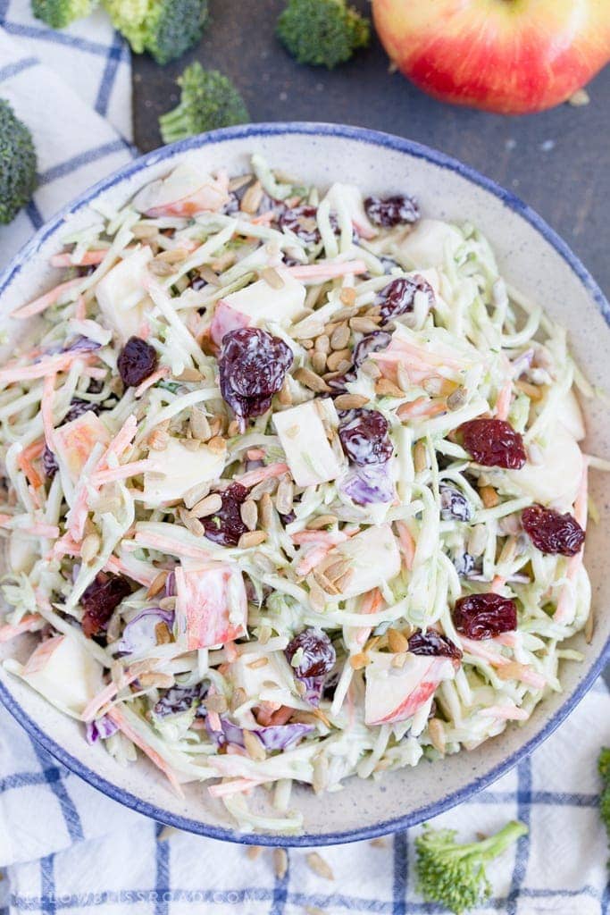 Broccoli Slaw with Apples & Dried Cherries is creamy, crunchy and sweet, making it the best side dish for summertime barbecues to Thanksgiving dinner.