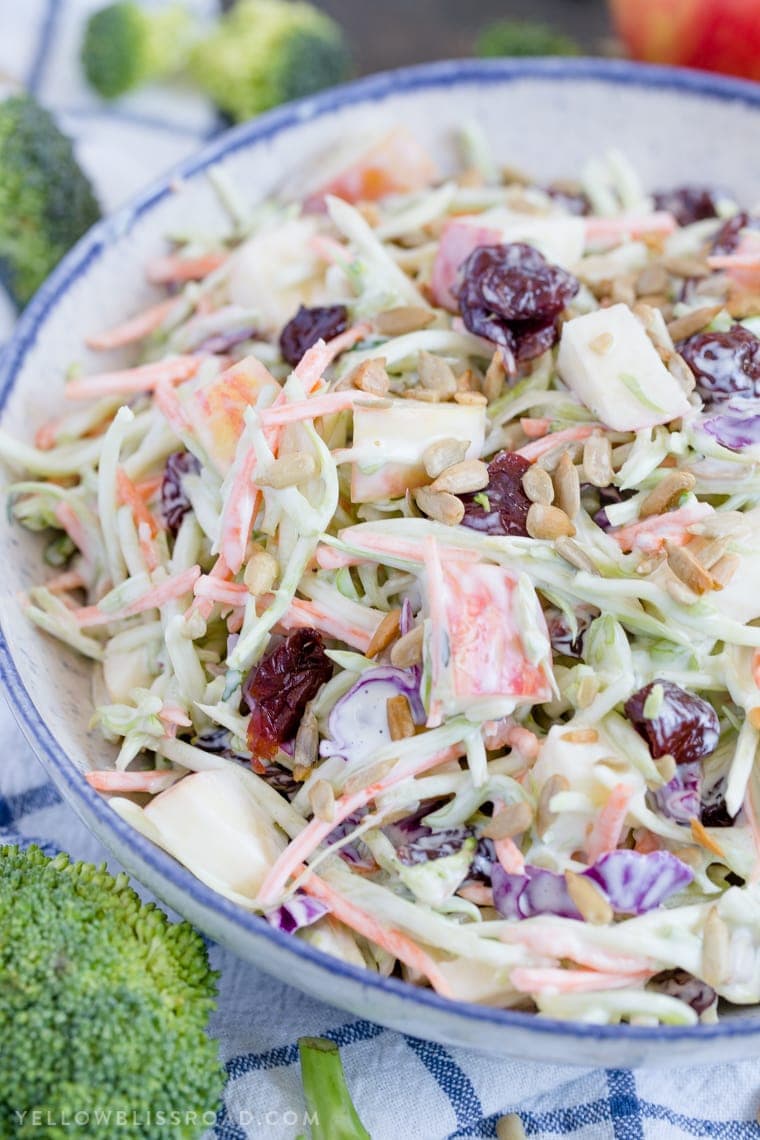 Broccoli Slaw with Apples & Dried Cherries is creamy, crunchy and sweet, making it the best side dish for summertime barbecues to Thanksgiving dinner.