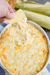 A close up of corn dip with chip