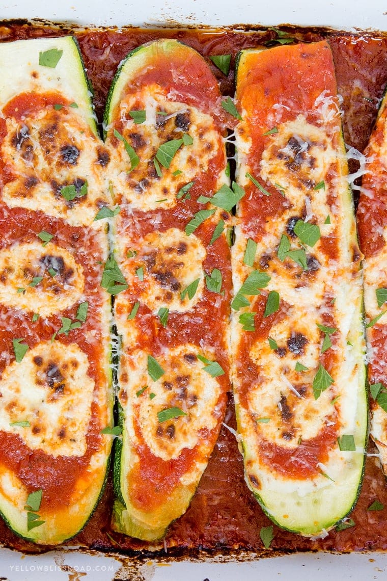 A close up of marinara zucchini boats