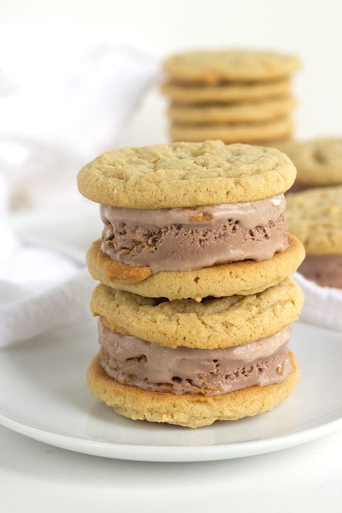 Peanut Butter Cookie and Chocolate Ice Cream Sandwiches are perfectly chewy homemade peanut butter cookies stuffed full of chocolate peanut butter ice cream.