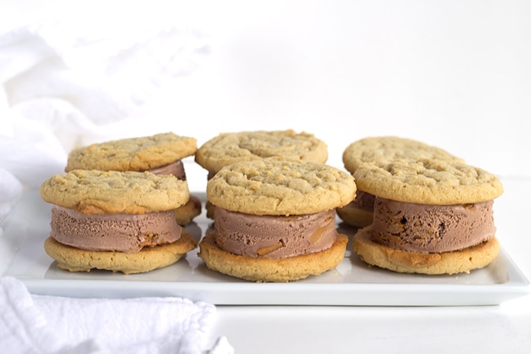 Peanut Butter Cookie and Chocolate Ice Cream Sandwiches are perfectly chewy homemade peanut butter cookies stuffed full of chocolate peanut butter ice cream.