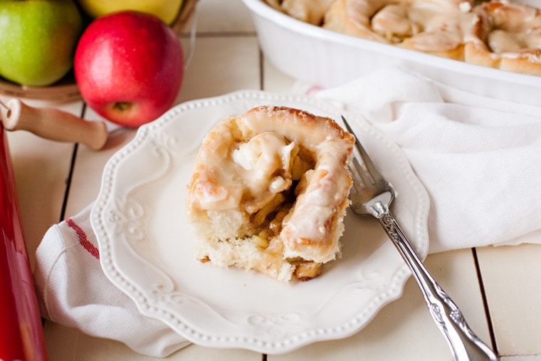 Apple Walnut Cinnamon Rolls topped with Caramel Frosting. The perfect treat for fall!