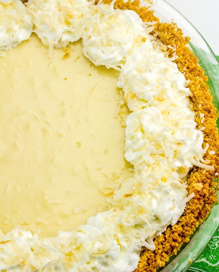 Tart, fruity and sweet this Coconut Key Lime Pie is one of the best and most loved dessert pies! This pie even had coconut IN the crust!