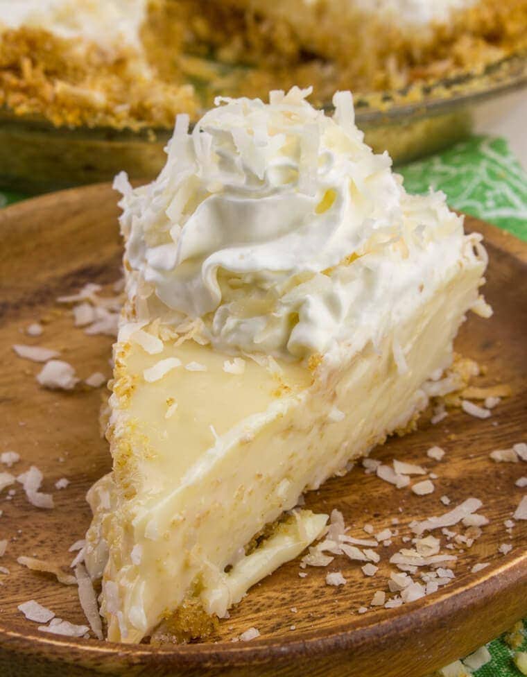 Tart, fruity and sweet this Coconut Key Lime Pie is one of the best and most loved dessert pies! This pie even had coconut IN the crust!