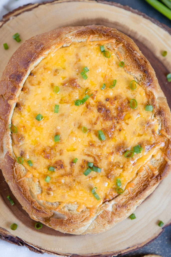 chili cheese dip in a bread bowl