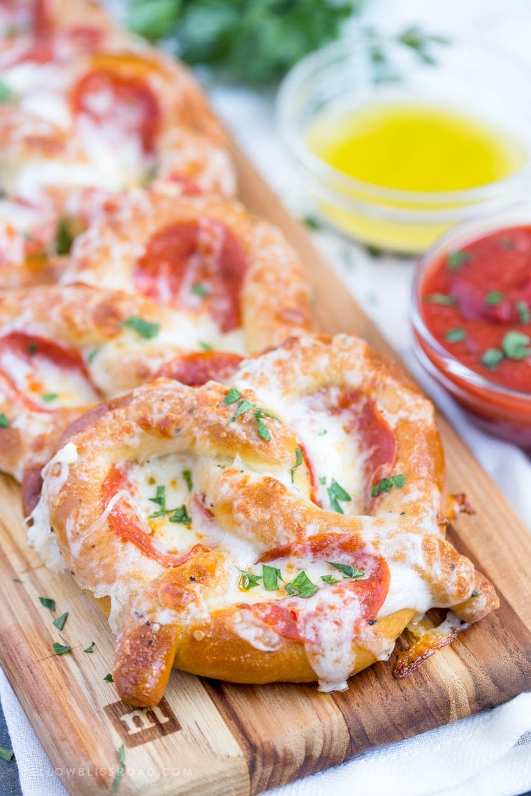 These Easy Garlic Butter Pizza Pretzels are a perfect after school snack and are also great hand-held food for game day parties!