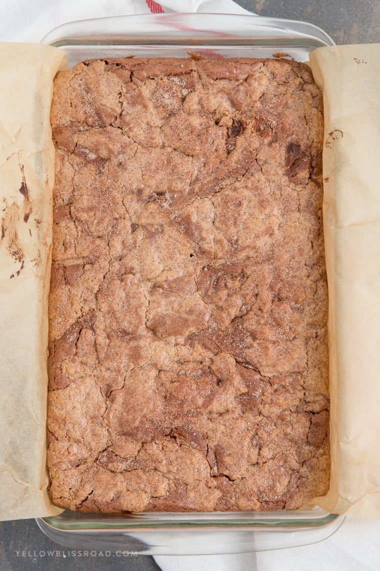 Snickerdoodle Brownies are the best of both worlds - fudgy, chocolatey brownies mixed with warm, cinnamon Snickerdoodles! It's the ultimate classic mash-up dessert!