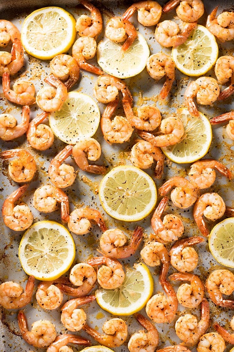 Sheet Pan Lemon Pepper Shrimp with slices of lemon scattered throughout