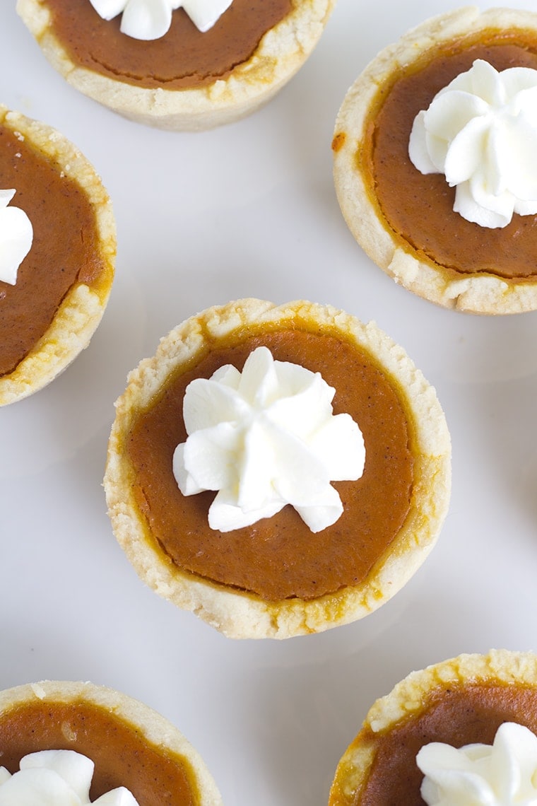 Mini maple pumpkin pies that are perfect for Fall! They have a hint of maple in every bite and a healthy dose of pumpkin spice! They are a perfect dessert!