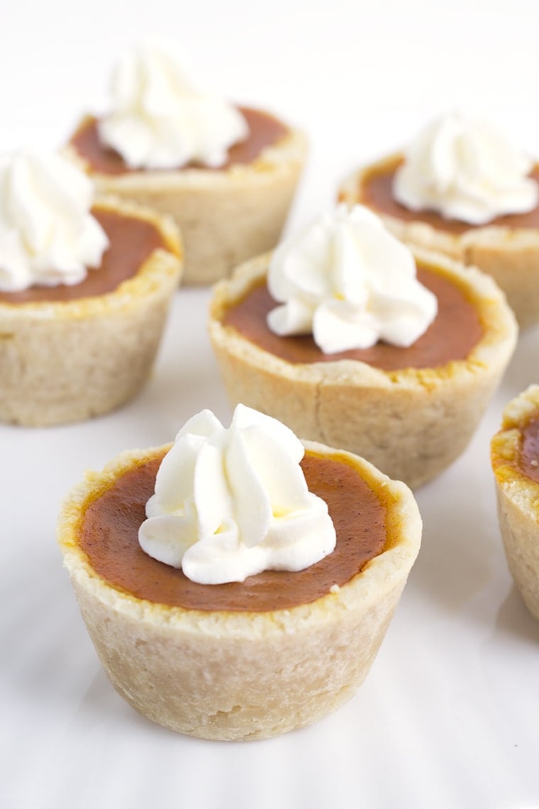 Mini maple pumpkin pies that are perfect for Fall! They have a hint of maple in every bite and a healthy dose of pumpkin spice! They are a perfect dessert!