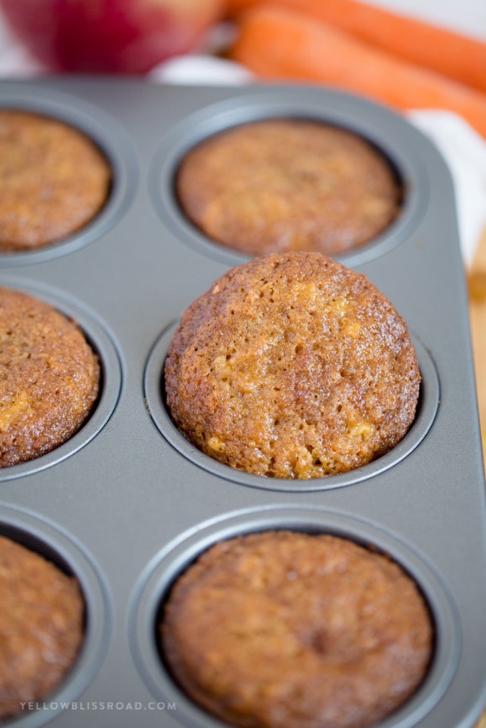 These Carrot Apple Raisin Muffins are incredibly moist and tender, delicious for breakfast or snacking and perfect for packing in kids' lunches.
