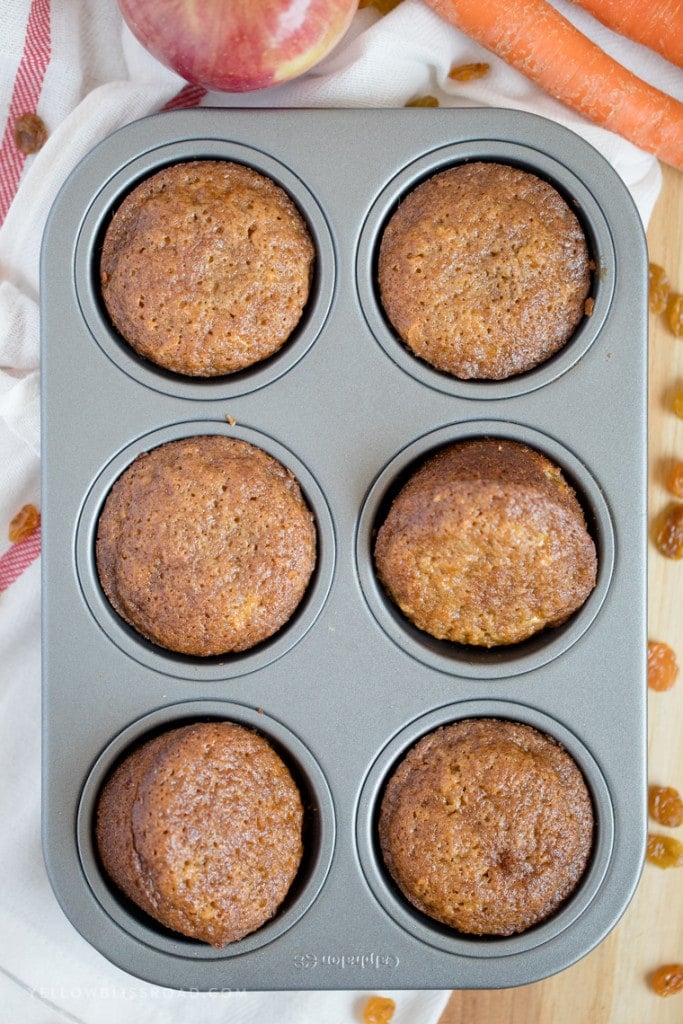 These Carrot Apple Raisin Muffins are incredibly moist and tender, delicious for breakfast or snacking and perfect for packing in kids' lunches.