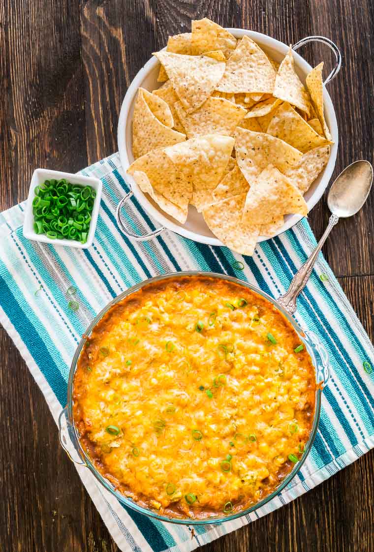 Cheesy Hot 7 Layer Dip - The perfect appetizer for game day tailgating and parties! 