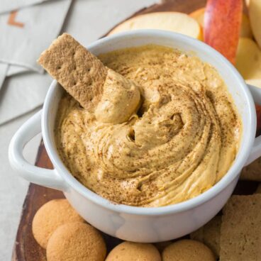 A bowl of pumpkin cheesecake dip