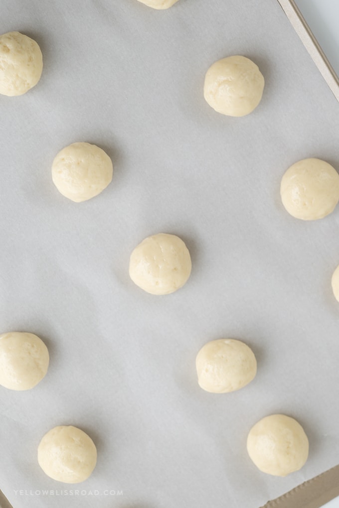 Nut free snowball cookie dough on a baking sheet.