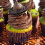 Witch Hat Cupcakes - These cupcakes are a green and black colored yellow cake mix, topped with a homemade chocolate frosting, a drizzle of green candy melt and finished with a cute little witch hat. These are the perfect halloween treat for kids!