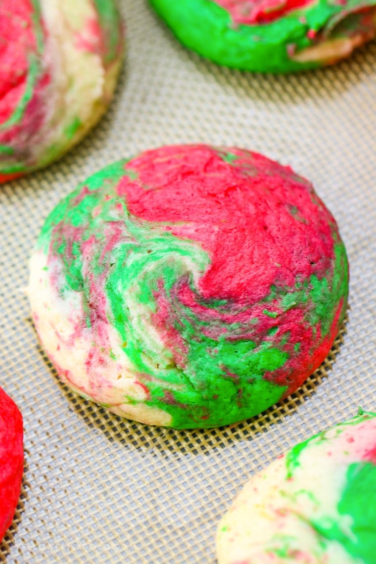 Christmas Cheesecake Cookies are creamy and tender, with just a hint of peppermint. The red, white and green swirls make them Santa's favorite cookie, too!