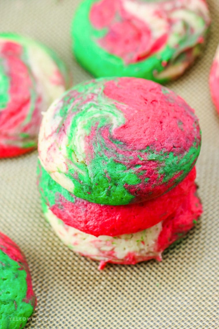 Christmas Cheesecake Cookies are creamy and tender, with just a hint of peppermint. The red, white and green swirls make them Santa's favorite cookie, too!