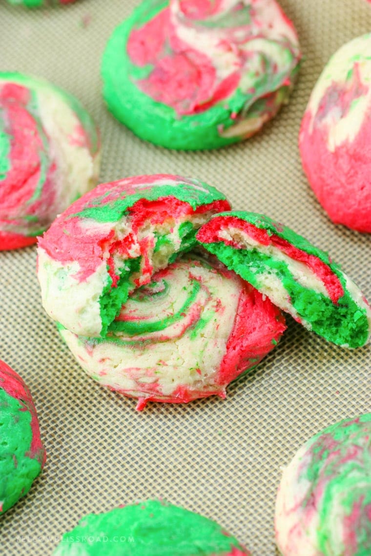 Christmas Cheesecake Cookies are creamy and tender, with just a hint of peppermint. The red, white and green swirls make them Santa's favorite cookie, too!