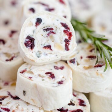 A close up of pinwheels filled with cream cheese and cranberries