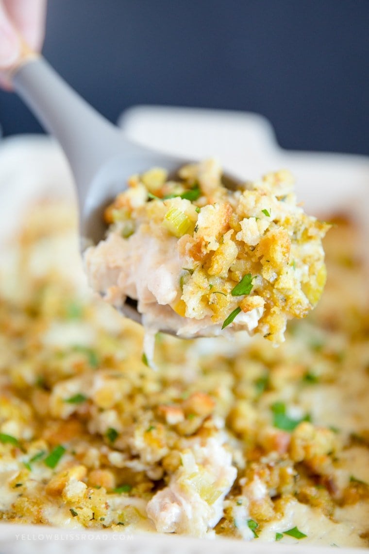 Leftover Turkey Casserole with stuffing - a large scoop on a serving spoon.