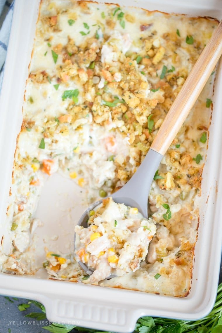 A casserole dish with leftover turkey casserole in it.