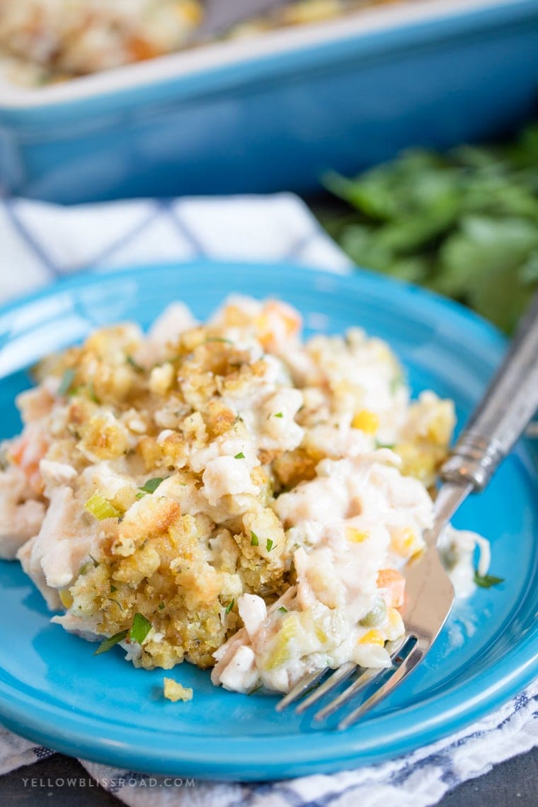 Turkey & Stuffing Casserole on a plate with a fork. | Leftover Turkey Recipes