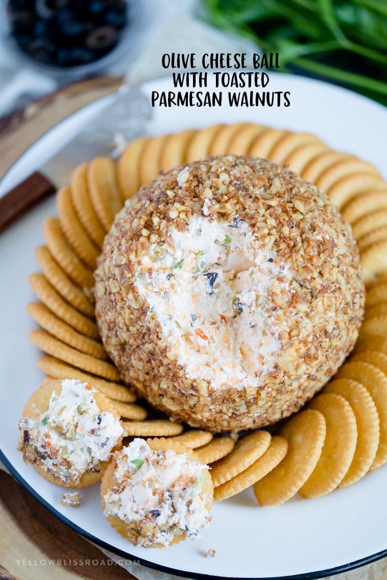 This Olive Cheese Ball with Parmesan Toasted Walnuts is fun and festive appetizer for the holidays. With loads of cheeses and olives, it's a crowd pleaser!