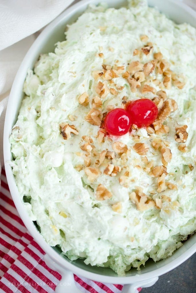 A large white dish filled with pistachio fluff salad