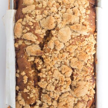 Pumpkin Bread with a Streusel topping - This dense, moist pumpkin bread full of spices and stopped with a streusel makes the perfect Fall quick bread! It's packed full of great flavor!