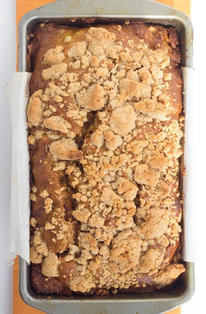 Pumpkin Bread with a Streusel topping - This dense, moist pumpkin bread full of spices and stopped with a streusel makes the perfect Fall quick bread! It's packed full of great flavor!
