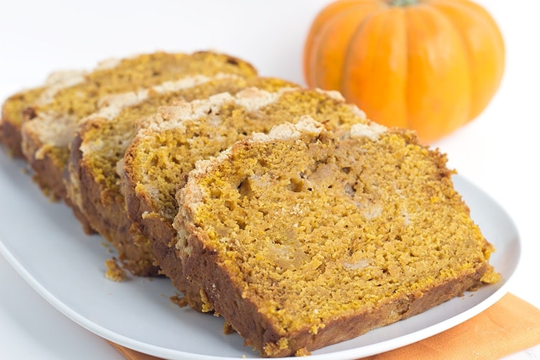 Pumpkin Bread with a Streusel topping - This dense, moist pumpkin bread full of spices and stopped with a streusel makes the perfect Fall quick bread! It's packed full of great flavor!
