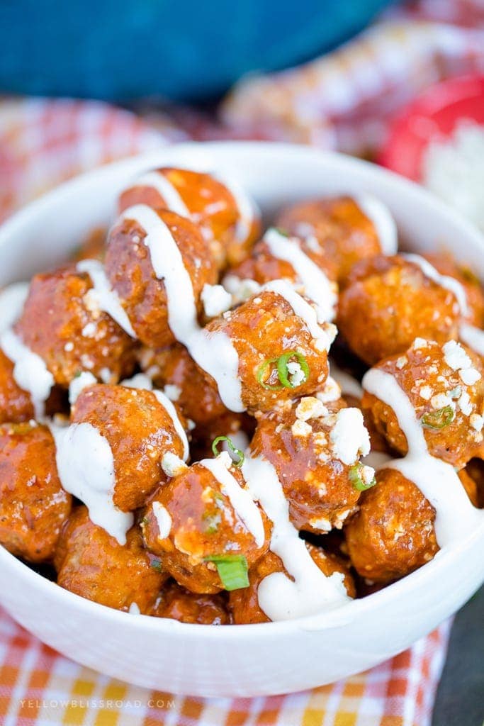 Buffalo Ranch Meatballs drizzled with ranch dressing and blue cheese