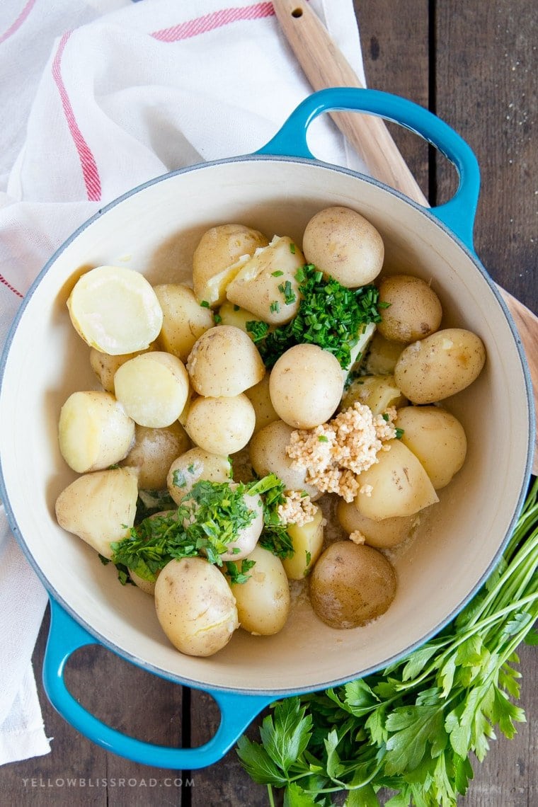 Baby Potatoes ready to be coated in melted butter with garlic, chives and parley.