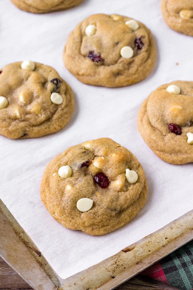 Orange Cranberry White Chocolate Chip Cookies baked on a cookie sheet.