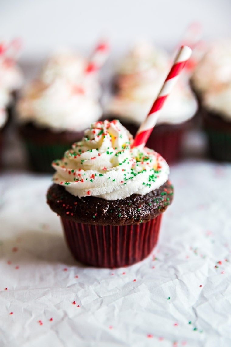 Peppermint Hot Chocolate Cupcakes behind the main one up front and in focus.