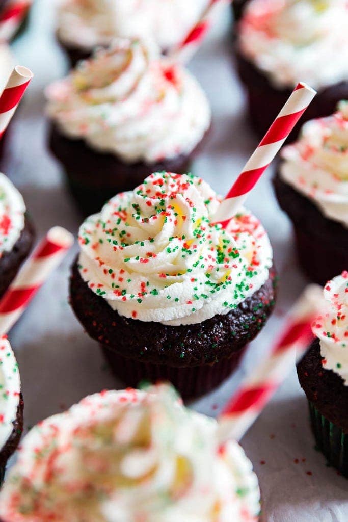 Rows of Peppermint Hot Chocolate Cupcakes with the middle one in focus.