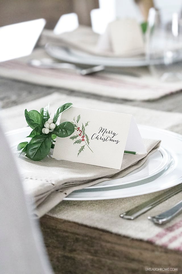 A flower on a place card on a table