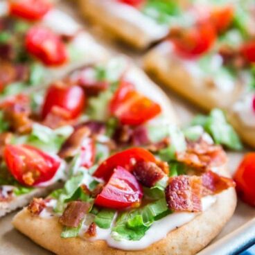 A close up shot of a slice of BLT Ranch Flatbread