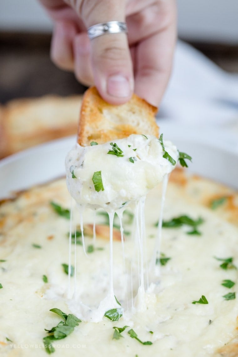 A close up of cheesy garlic dip