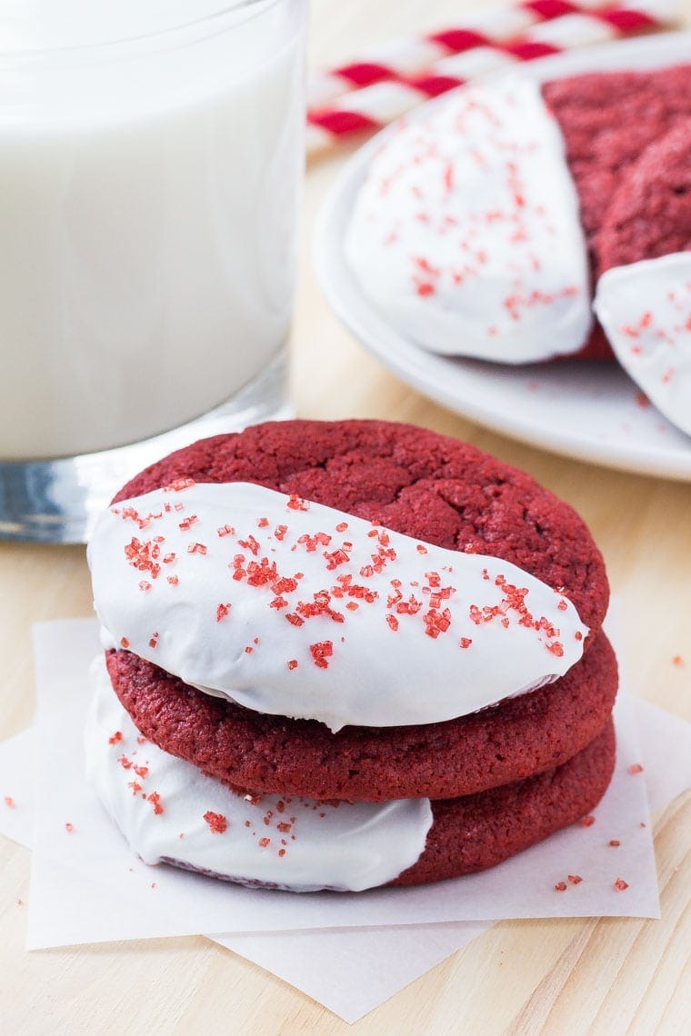 A stack of red velvet cookies with a cold glass of milk is the perfect treat for Valentine's Day. 