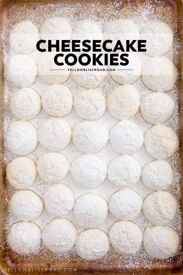 Cheesecake Cookies - A creamy, tender and delicious cookie that's a not too sweet but totally addictive dessert! A tray of cheesecake cookies with text overlay