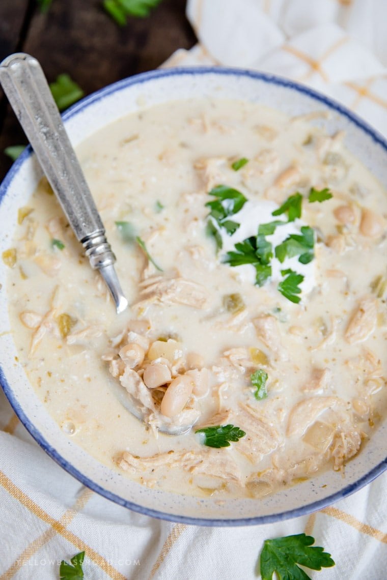 White Chicken Chili with a spoonful showing on top of the bowl